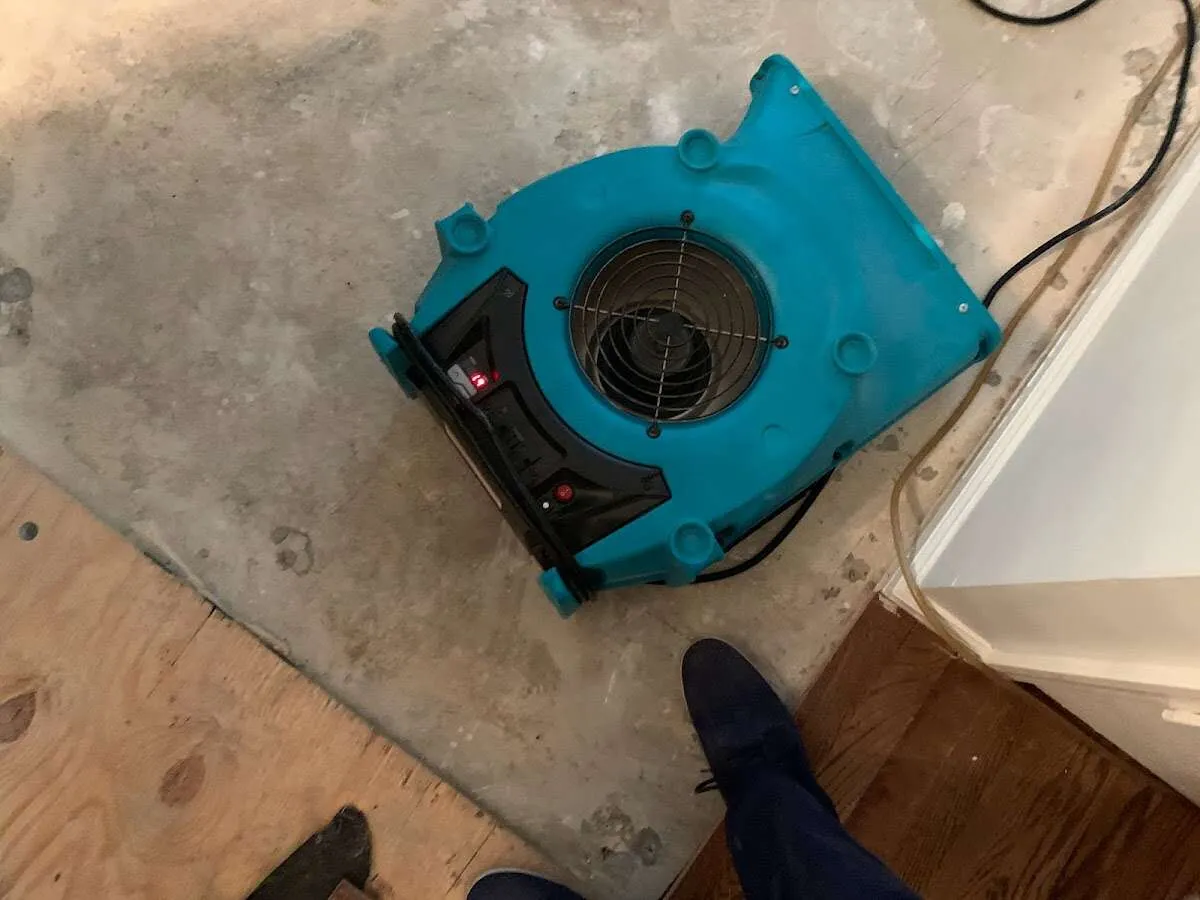 Air mover drying subfloor during Commercial Water Damage Restoration in Arizona City
